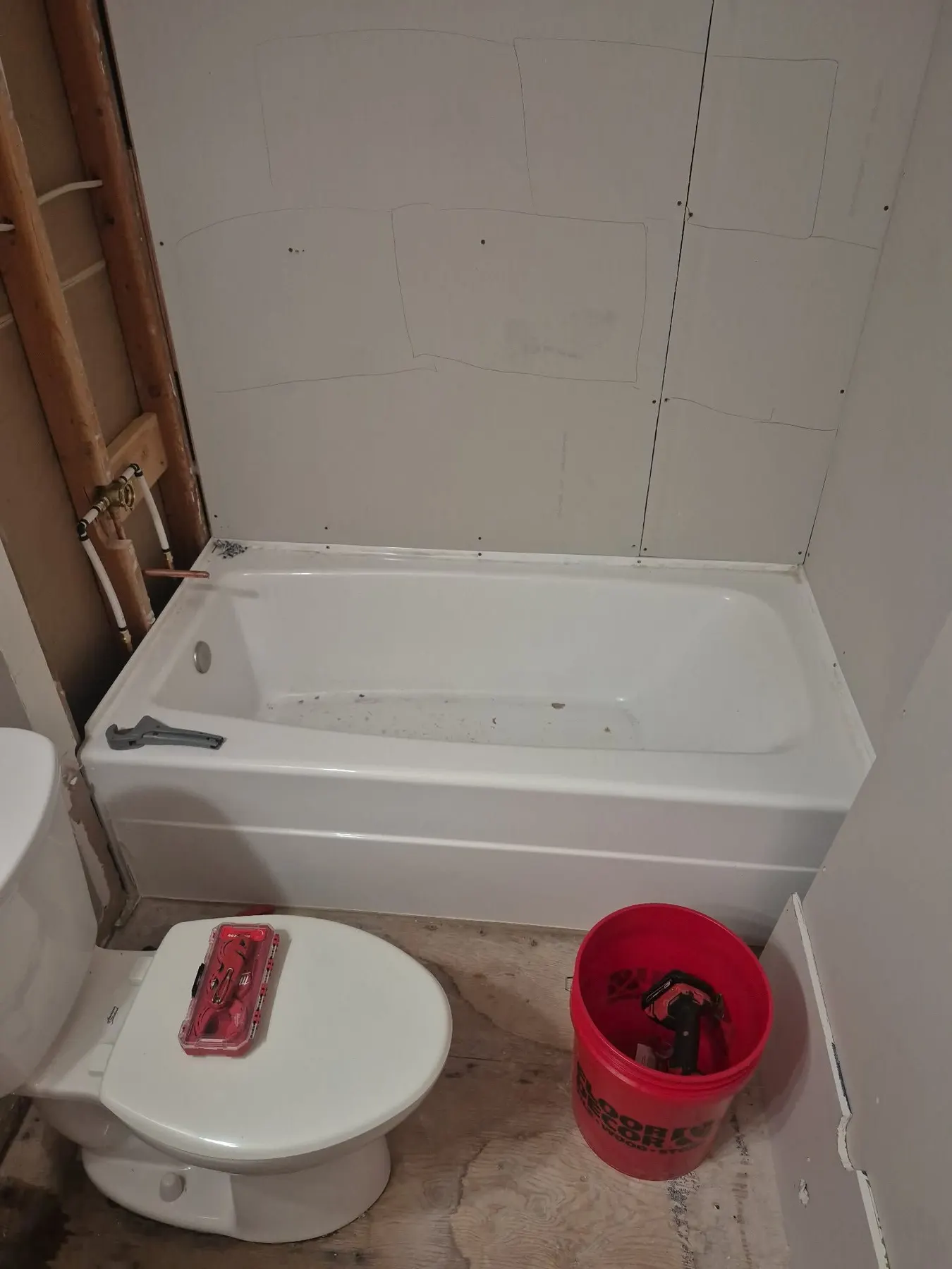 Bathroom with the tub and toilet in place before finish work