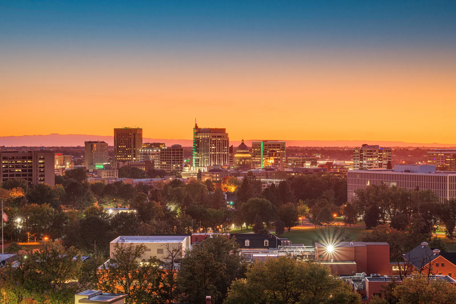 Downtown Boise skyline and the Idaho State Capitol at sunset
