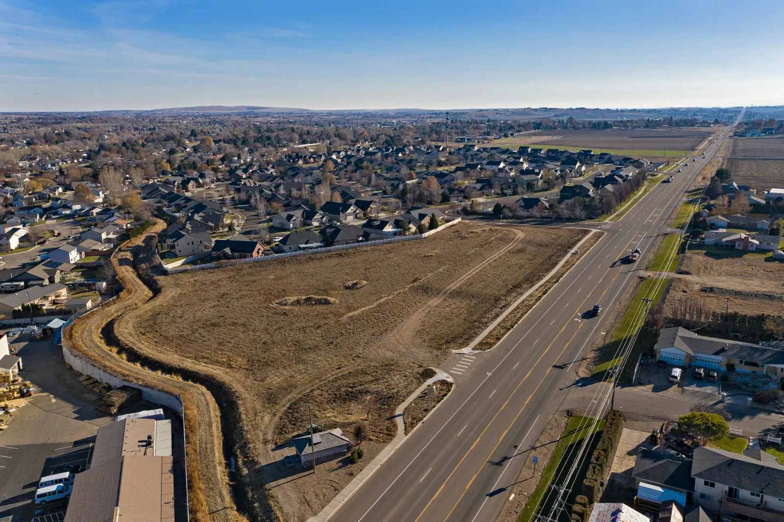 Aerial view of a Nampa neighborhood beside open farmland