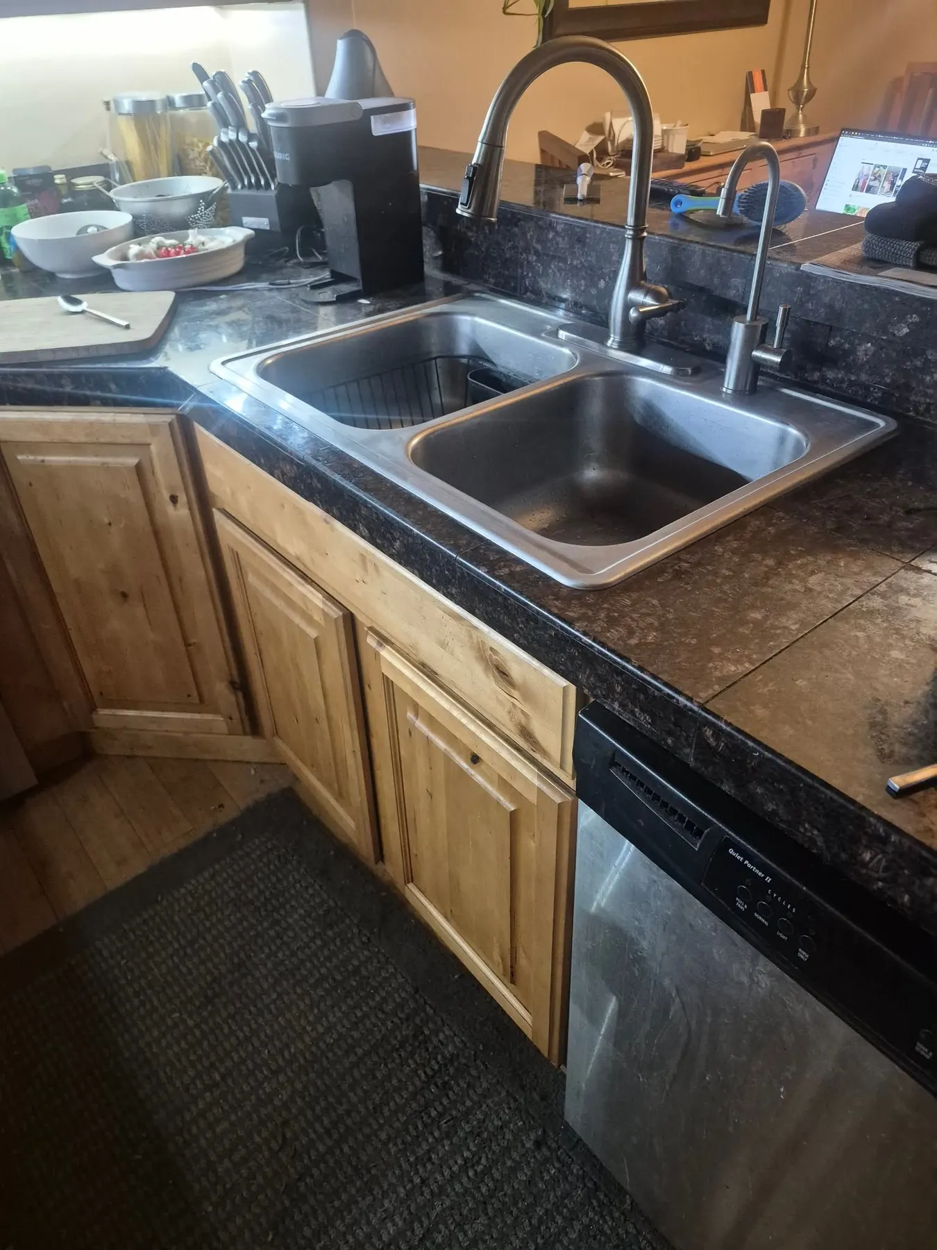 Kitchen with a double basin sink and faucet