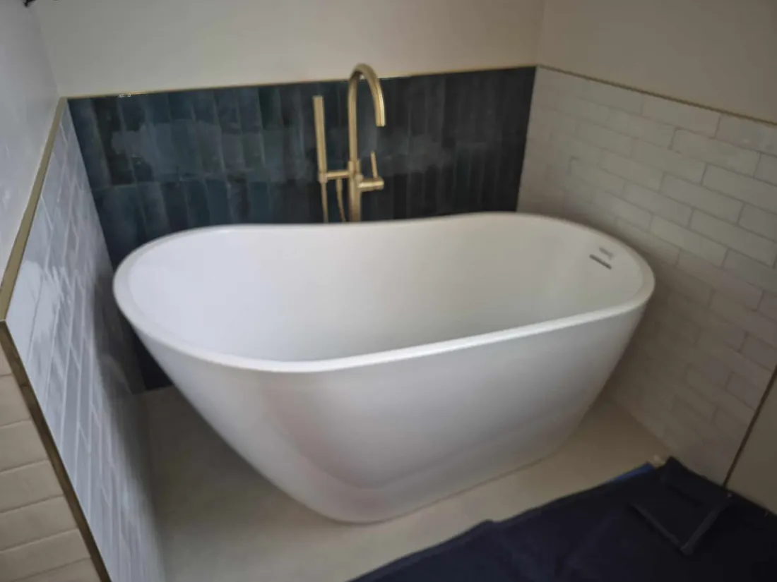 Finished bathroom with a freestanding tub