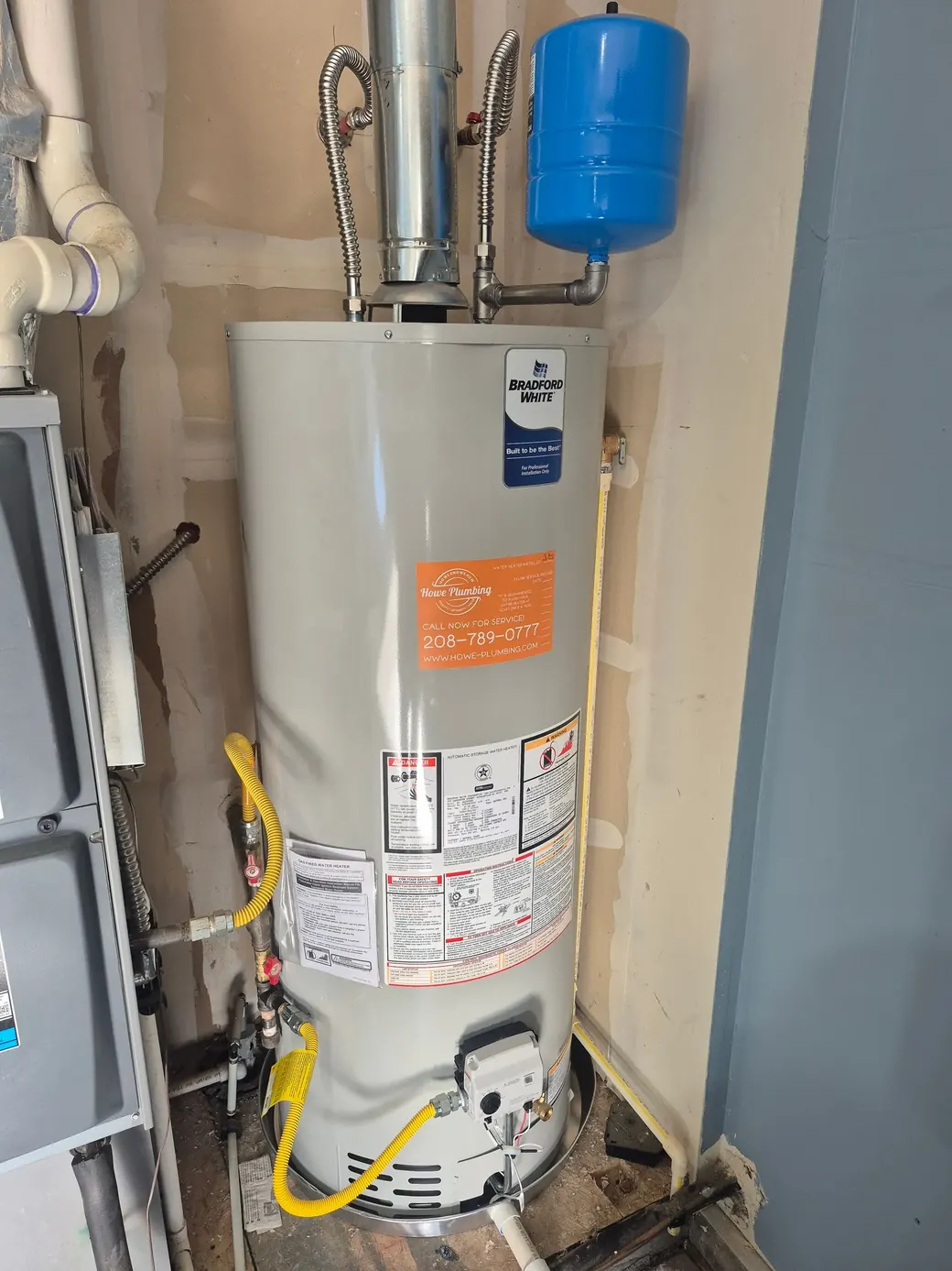 Tank water heater installed by Howe Plumbing